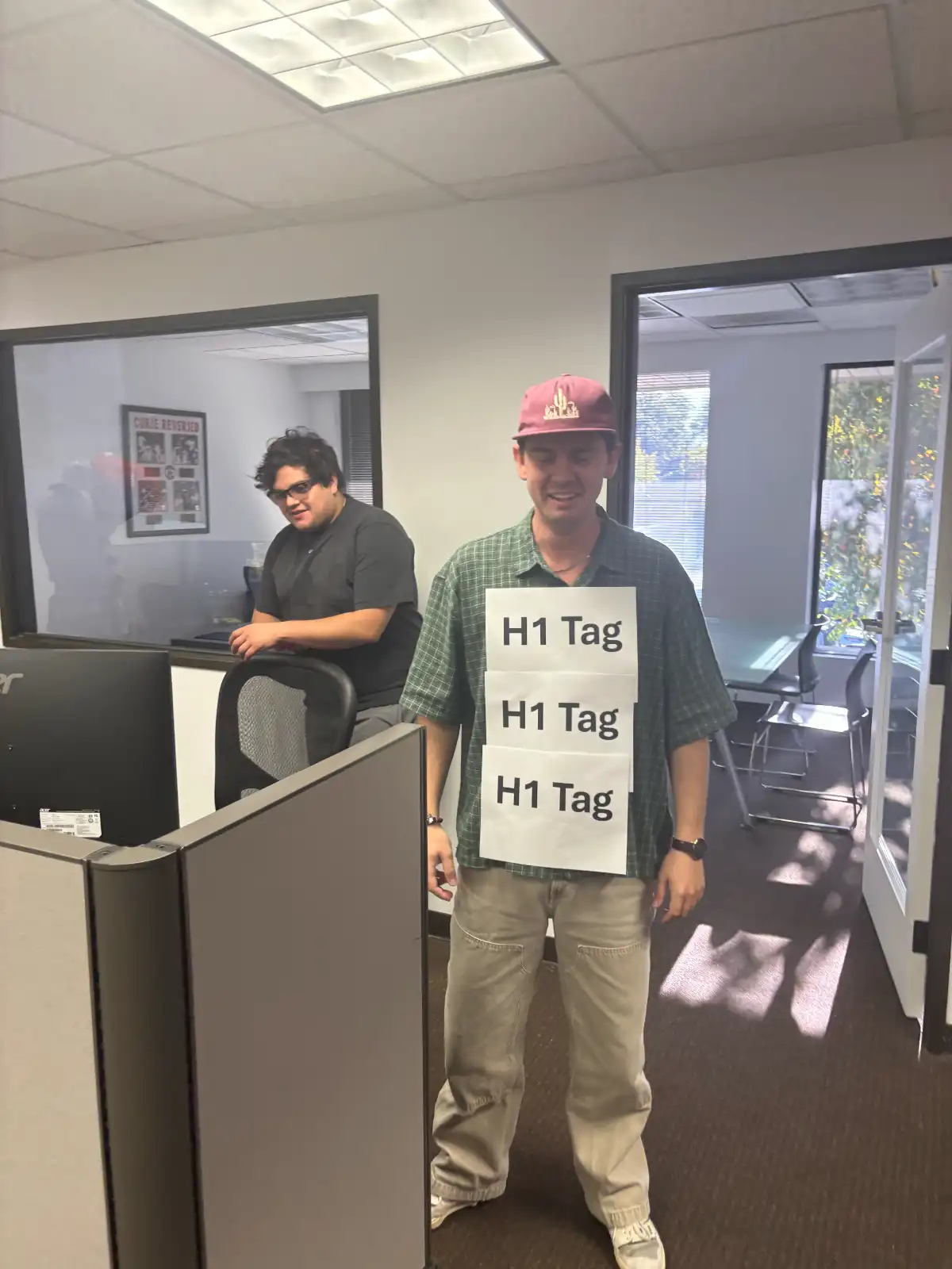 man wearing h1 tag joke signs